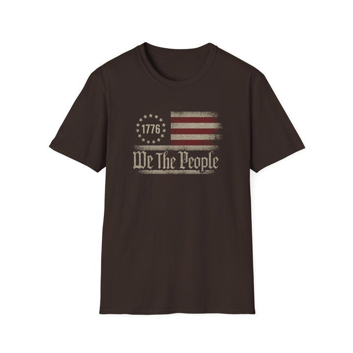 Dark chocolate unisex t-shirt with a distressed vintage Betsy Ross flag and old-style blackletter text reading We The People with 1776 in the star circle
