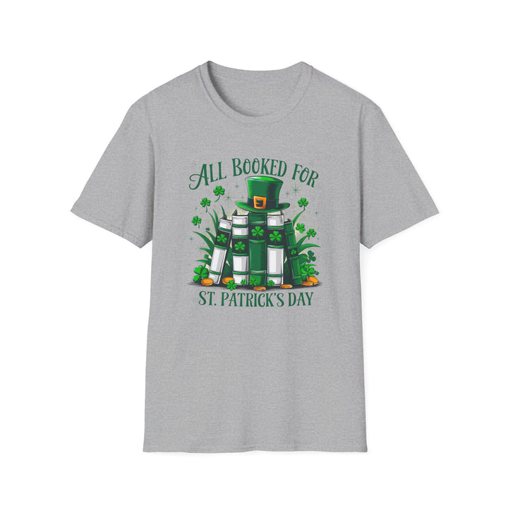 Sport grey unisex t-shirt with an illustrated stack of green books topped with a leprechaun hat surrounded by shamrocks and the text All Booked for St. Patrick&