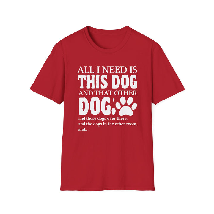 Red unisex t-shirt with bold bubble text reading All I Need Is This Dog and That Other Dog with a paw print accent