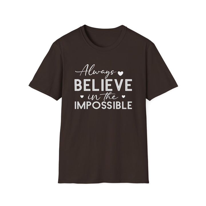 Dark chocolate unisex t-shirt with script and dotted block lettering reading Always Believe in the Impossible with small heart accents