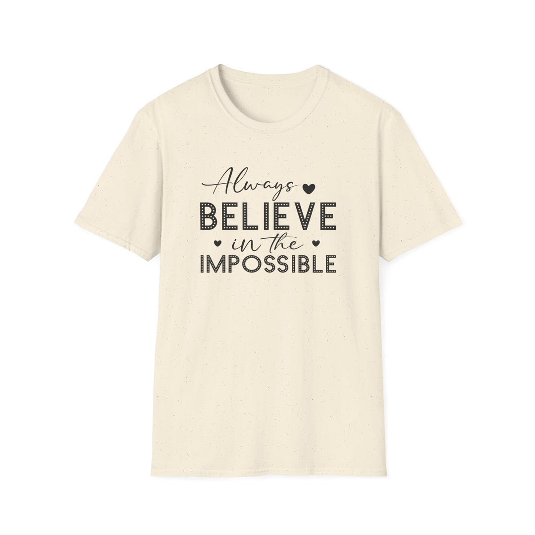 Natural unisex t-shirt with script and dotted block lettering reading Always Believe in the Impossible with small heart accents