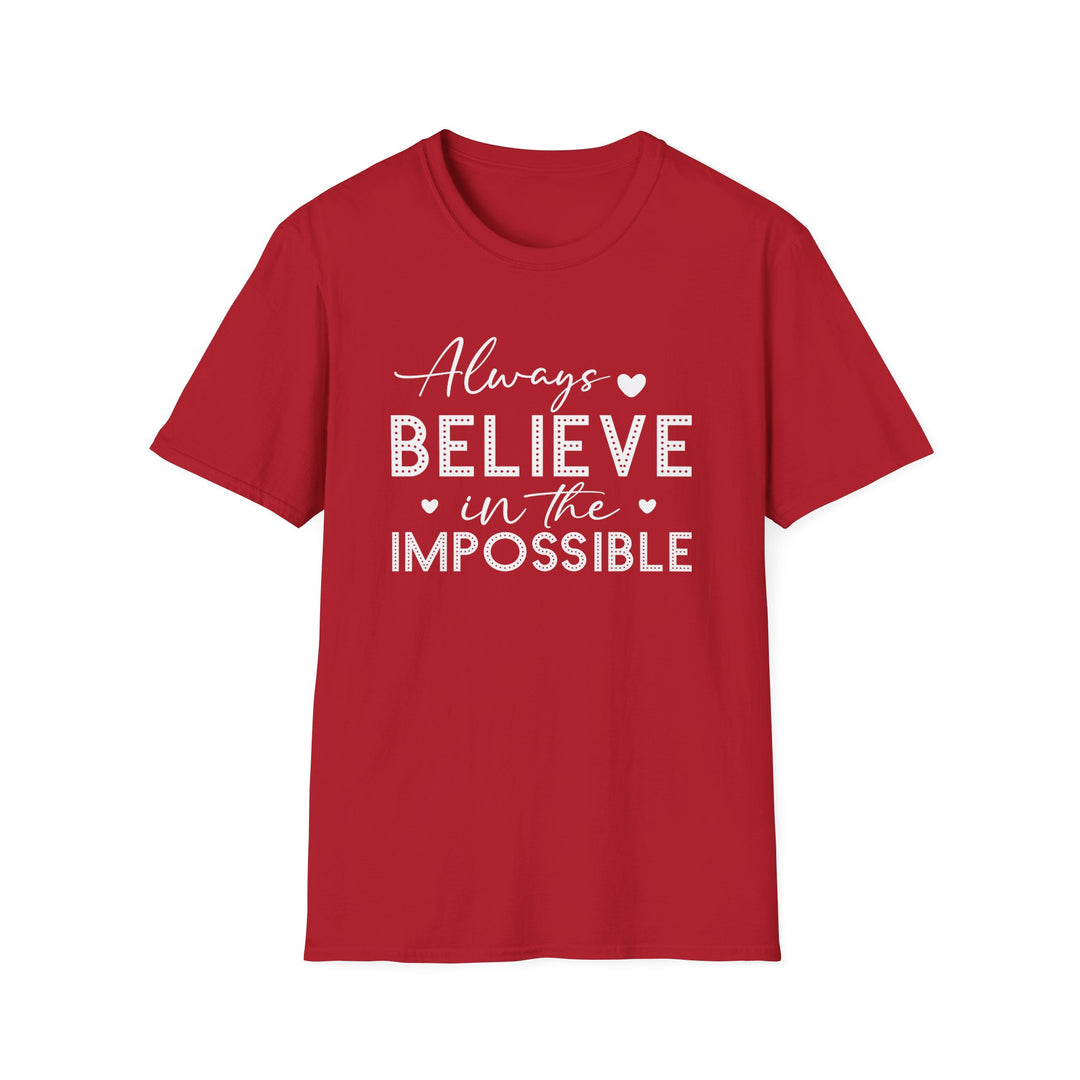 Red unisex t-shirt with script and dotted block lettering reading Always Believe in the Impossible with small heart accents
